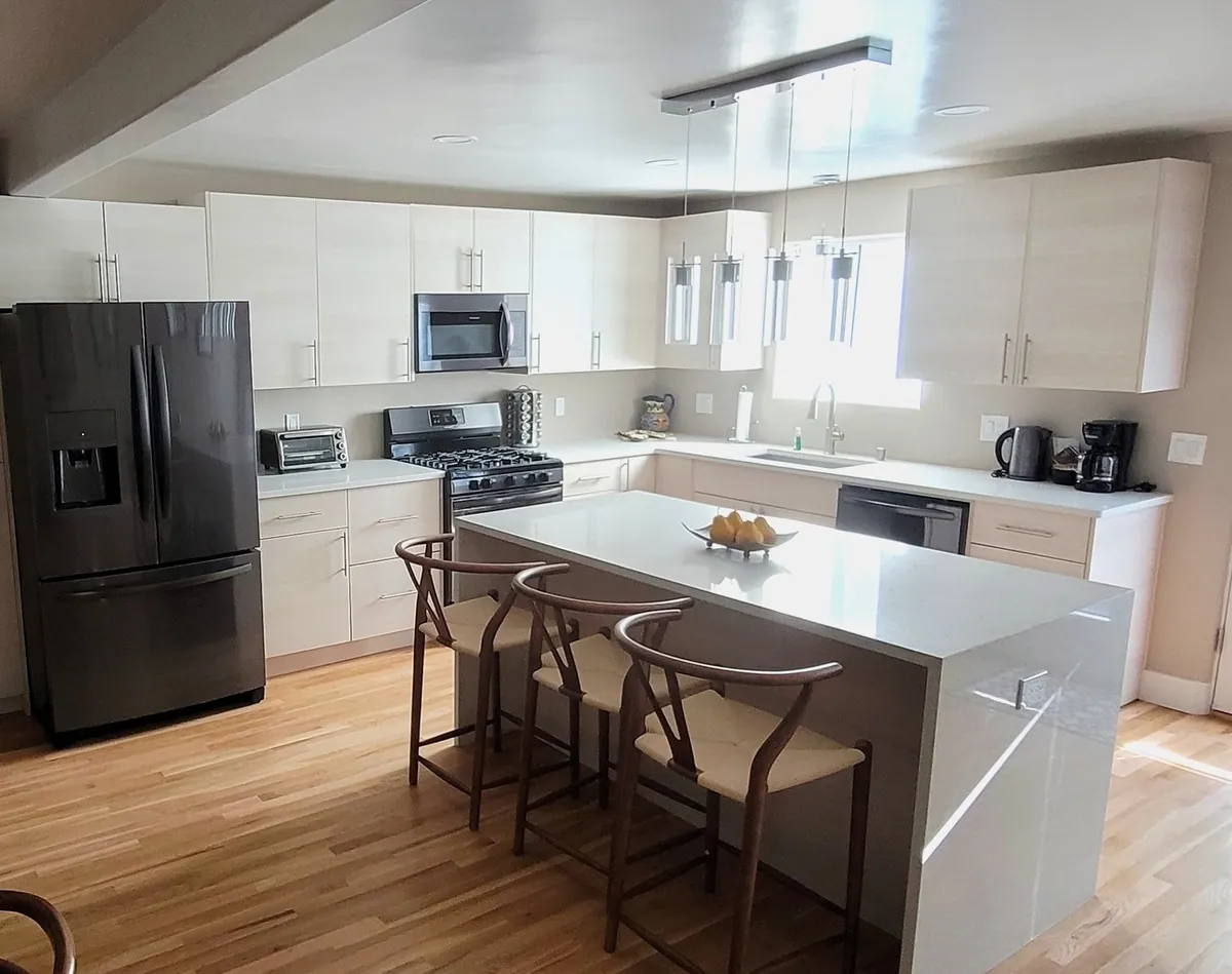 Custom kitchen with Torino White Pine frameless cabinets from the AltaEuro Collection